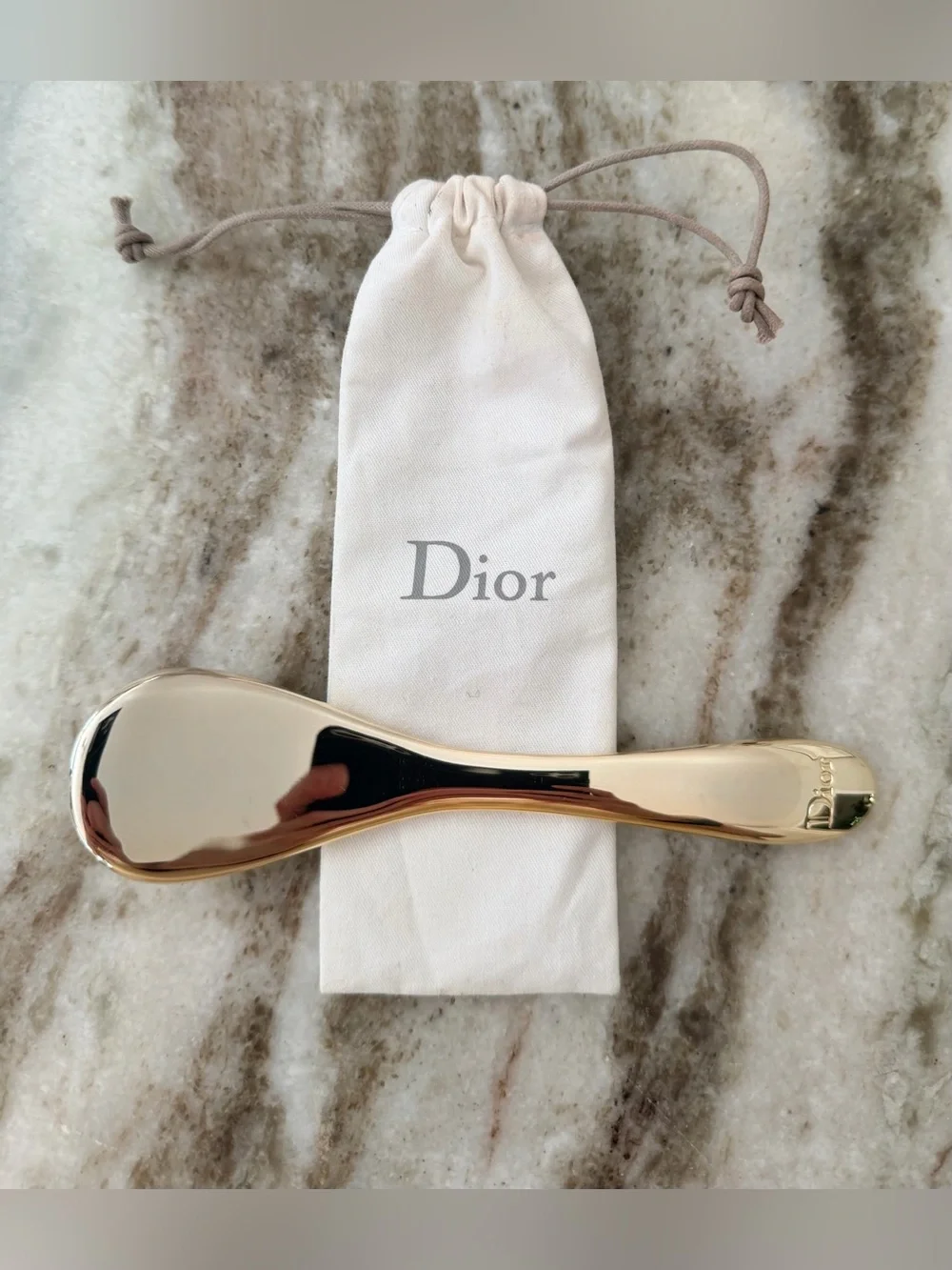 Dior Prestige Le Pétale Multi-Perlé Massage Tool with a branded protective pouch